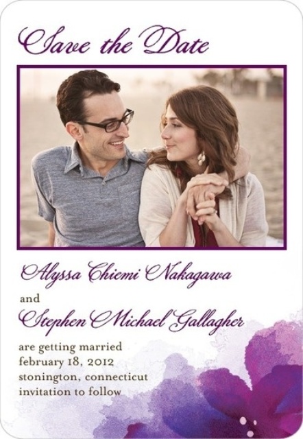 an elegant save the date magnet with a colored couple's photo, purple calligraphy and some printed blooms