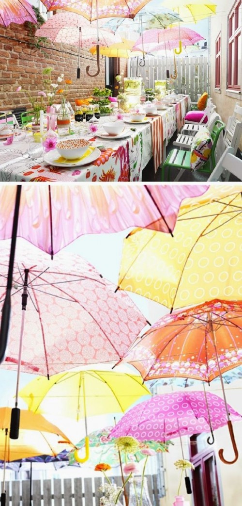 a colorful backyard bridal shower with umbrellas, bright blooms, linens and colorful plates for a summer feel