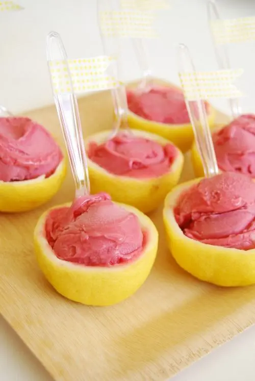 fresh ice cream served in half lemons is a delicious and refreshing dessert for a summer wedding