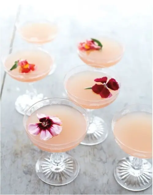 pink drinks topped with edible blooms are ideal for a spring or summer bridal shower or just a gathering of girls