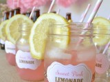 sweet pink lemonade with citrus and straws in jars is right what you need to make your guests happy
