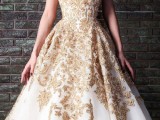 a strapless white and gold lace applique wedding ballgown is a refined and chic idea for a bride