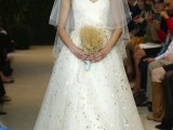 a strapless wedding ballgown with gold leaf touches, a veil and a wheat wedding bouquet for a refined bridal look