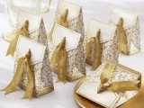 white and gold printed packs with sweets are great for a refined gold and white wedding