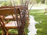 white and blush petals and willow arrangements to line up the spring aisle and make it look fresh, to embrace the season