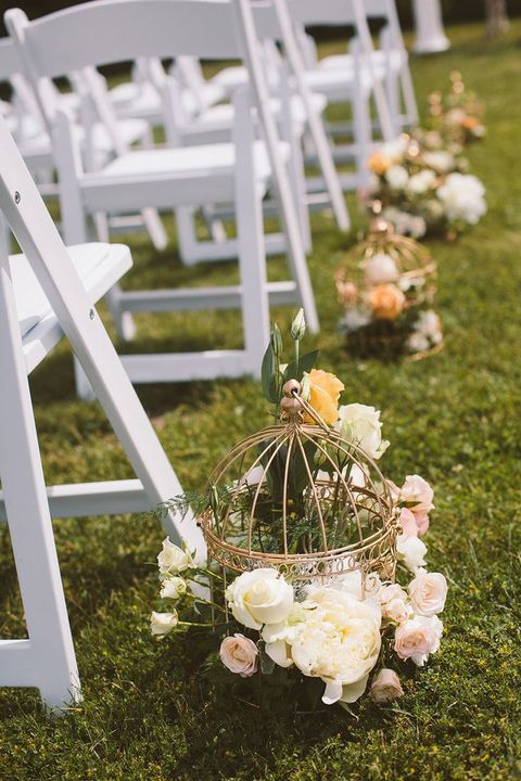 refined cages with yellow, white and blush roses and greenery are gorgeous for a vintage-inspired spring or summer wedding