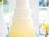 an ombre white to yellow textural wedding cake topped with yellow and white blooms is a bright idea for a spring wedding