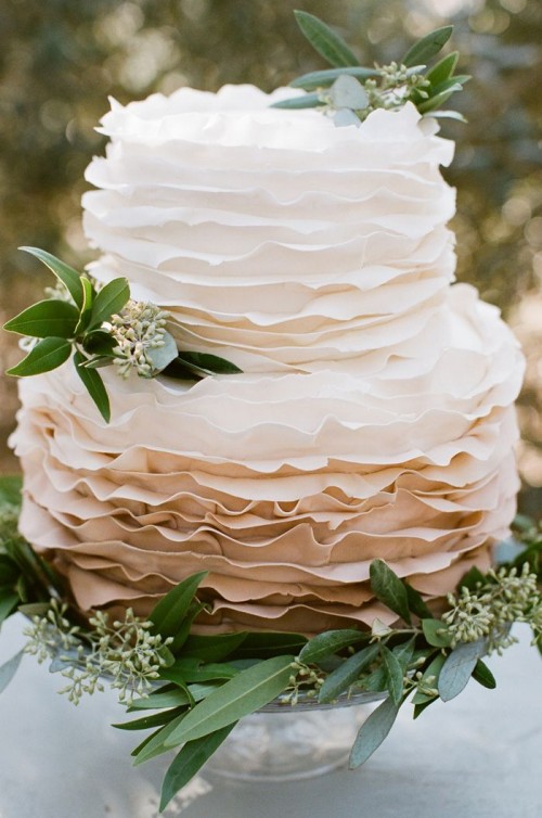 an ombre white to taupe ruffle wedding cake decorated with eucalyptus is a pretty solution for a spring or summer wedding