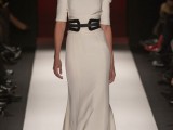 a vintage wedding dress with a catchy neckline, puff short sleeves and a black leather belt