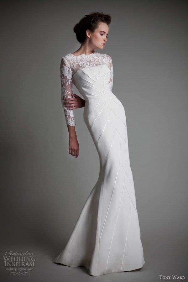 A modern and refined sheath wedding dress with a lace illusion neckline, geometric embroidery on the whole dress