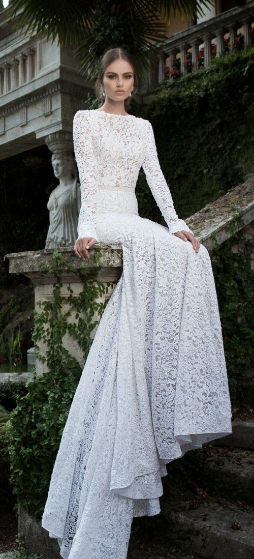 a lace sheath wedding dress with a high neckline, long sleeves and a train is modern classics that always looks chic