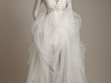 a chic winter wedding dress with a lace bodice with a V-neckline, long sleeves, an embellished sash and a layered skirt