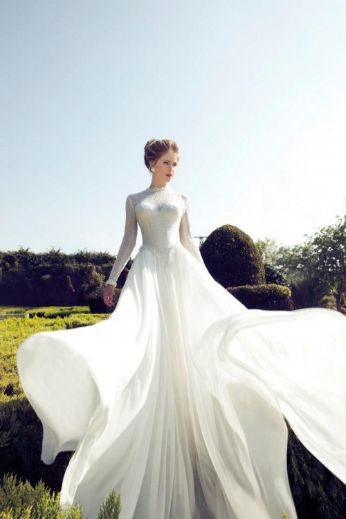 a romantic sparkling wedding dress of lace, with a high neckline, long sleeves and a train is a very refined piece