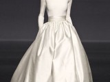 a modern wedding ballgown with a matte white bodice with long sleeves and a high neckline, with a shiny full skirt