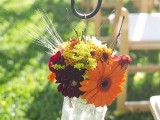 a bright fall flower aisle decoration is a great idea not only for a vineyard wedding but also for many other fall weddings, too