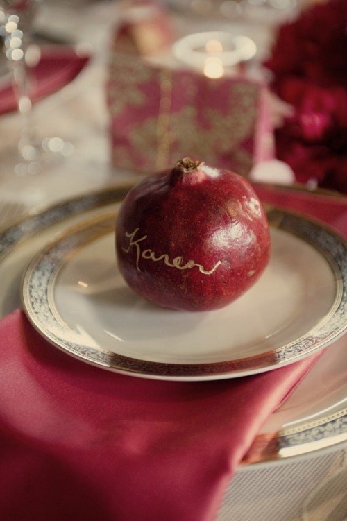 use real fruit as wedding cards, here a large pomegranate is a lovely idea for a fall vineyard wedding