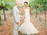 a pretty fall vineyard wedding portrait in the green vines is a lovely idea for an early fall vineyard wedding