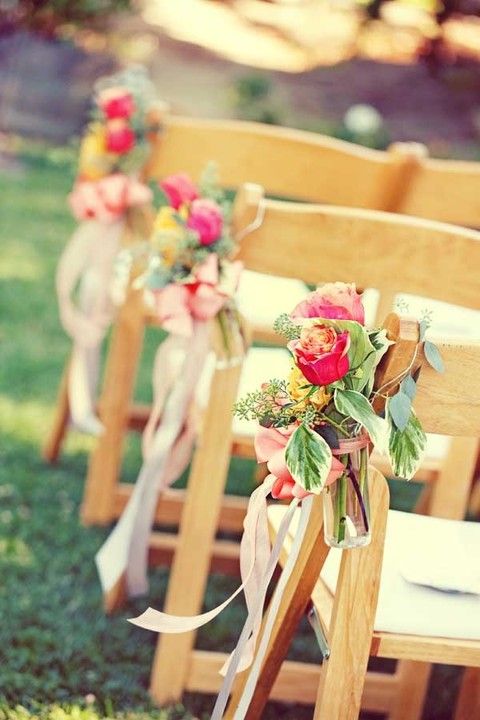 a bright flower and greenery arrangement is a great idea for a fall vineyard or some other wedding