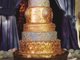 a Royal wedding cake in gold and grey and gold patterns looks really refined and very gorgeous