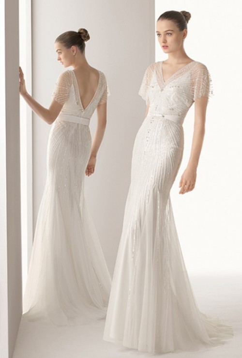 an art deco embellished mermaid wedding dress with a V-neckline, cap sleeves and a train is a chic idea for an art deco bride who wants to stand out
