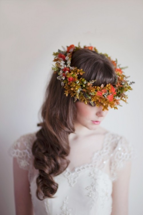 lovely waves down accented with a bold fall floral crown with greenery and leaves is a pretty and timeless idea for a fall bride