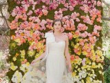an ombre floral wedding backdrop from pink to yellow and white plus moss as a background