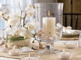 a white orchid in a pot is always an elegant and very refined wedding centerpiece, add candles