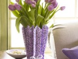 purple tulips in a vase covered with floral paper that matches are great for a spring wedding