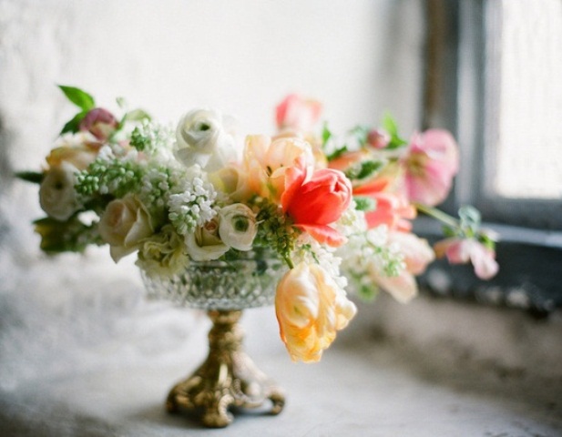 an elegant white, red and yellow floral centerpiece in a chic bowl is a cool idea for a spring wedding