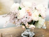 a beautiful neutral and pastel wedding centerpiece in light pink and white is a very chic and cute idea