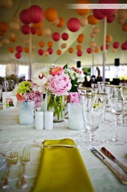 a pink and neutral floral wedding centerpiece with some greenery is a bold and chic idea to try