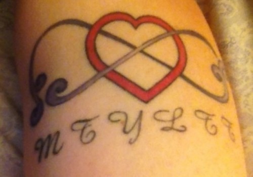 a red heart, an infinity sign and your monograms will be a creative tattoo that you will love for sure