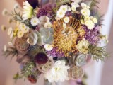 a whimsical wedding bouquet of chamomiles, lilac blooms, seed pods, succulents and pincushion proteas