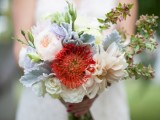 neutral peony roses, white roses, pincushion proteas, succulents and pale foliage are a bold combo for a wedding