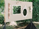 a wedding backdrop with frames of various kinds, skulls and decorations for taking pics