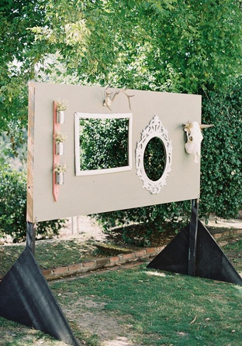 a wedding backdrop with frames of various kinds, skulls and decorations for taking pics