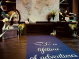 a map wedding or reception backdrop is a stylish idea, add paper planes and blooms around
