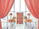 a bright bloom framed wedding backdrop is a very chic and refined idea for a wedding