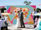 a colorful geometric backdrop will make your wedding bright, fun, whimsical and unusual
