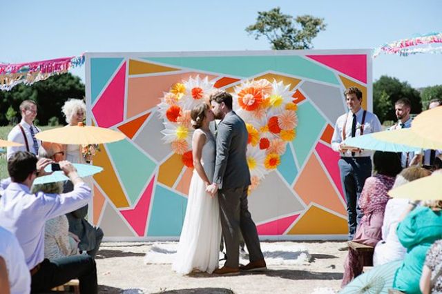 A colorful geometric backdrop will make your wedding bright, fun, whimsical and unusual
