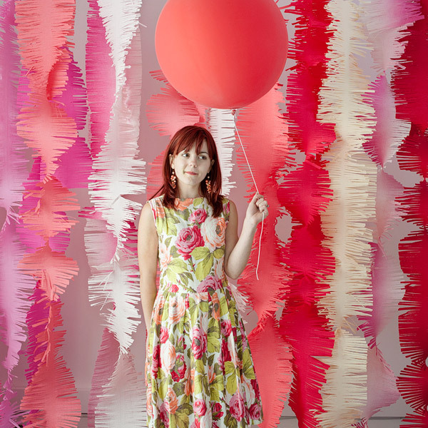 Colorful fabric strips and bright balloons will make your backdrop super fun and super bold