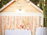 pastel and gold stripes reception backdrop with lights is a chic idea for any wedding, from glam to rustic
