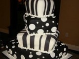 a bold square wedding cake imitating pillows in black and white, with polka dots and stripes