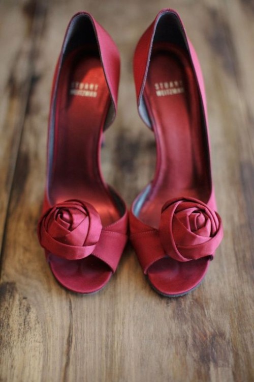 deep red fabric bloom wedding for a touch of color won't overdo with reds yet will add a splash of color