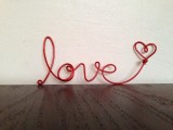 a LOVE word made of red wire is a cool idea for wedding decor in any season