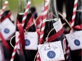 Coke bottles with tags and striped straws are amazing for having a drink at the wedding