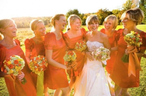 bold orange mini bridesmaid dresses with square necklines and puff sleeves are a very trendy solution to rock right now