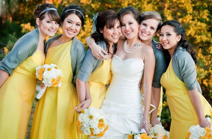 mismatching yellow bridesmaid dresses with grey boleros are a bold and contrasting combo to rock at a fall wedding