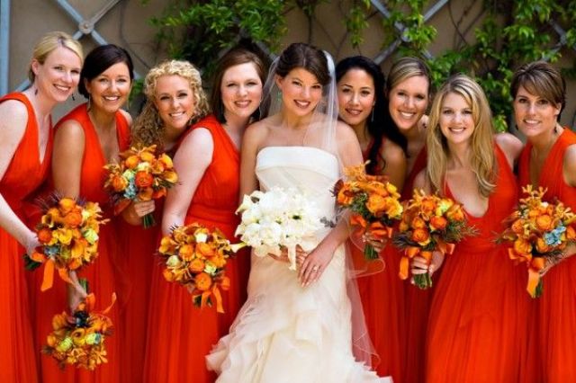 orange midi A line bridesmaid dresses with thick straps and a deep V neckline are classic for a bold fall wedding