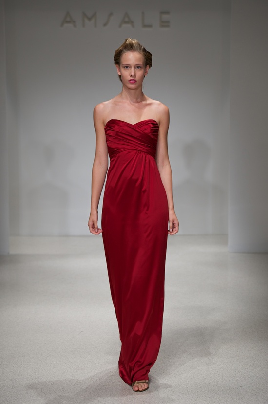 a strapless deep red maxi bridesmaid dress with a draped bodice and a plain skirt is a very chic and cool idea for a refined fall wedding